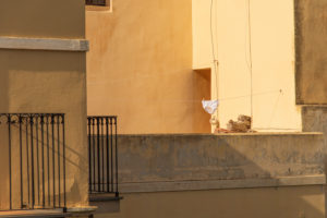 Sicily - Sunny impressions of the Aeolian Islands, also known as Aeolian Islands or Isole Eolie: Lipari, Stromboli, Salina, Vulcano, Panarea, Filicudi and Alicudi. Clothesline with men's underpants in a courtyard. Sicily - Sunny impressions of the Aeolian Islands, also known as Aeolian Islands or Isole Eolie: Lipari, Stromboli, Salina, Vulcano, Panarea, Filicudi and Alicudi. Clothesline with men's underpants in a courtyard.